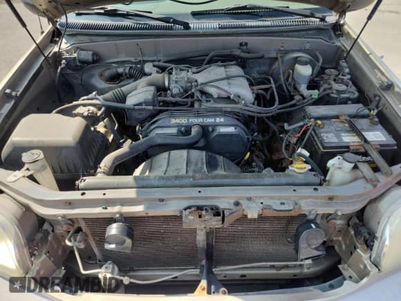 2002 Toyota Tundra SR5 z VIN 5TBRN34102S254202, wystawiony jako Copart lot #71814075 z przebiegiem 167 582 mil mil oraz Szkoda całkowita • Salvage title. Historia ofert i sprzedaży dostępna na DreamBid. Obrazek 11.