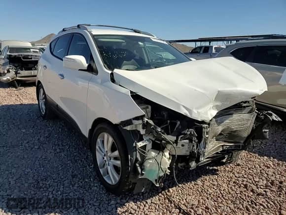 2011 Hyundai Tucson Limited with VIN KM8JU3AC7BU222304, listed as a Copart auction lot 71310104 with 118,726 mi miles and Salvage title. Bid and sale history available at DreamBid. Image 11.