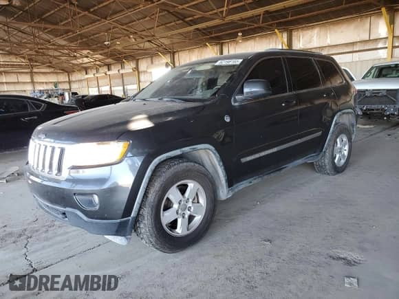 2011 Jeep Grand Cherokee Laredo с VIN 1J4RR4GG3BC660942, выставлен на аукционе Copart как лот 82198165 с пробегом 174 604 миль миль и Списание • Salvage title. История ставок и продаж доступна на DreamBid. Изображение 1.