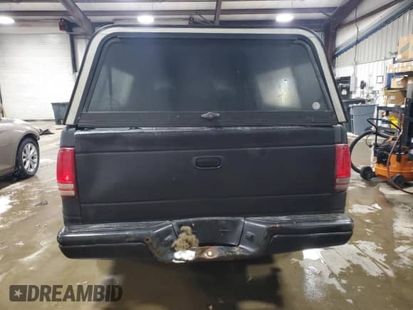 2002 Dodge Dakota z VIN 1B7FL16X32S557570, wystawiony jako Copart lot #88974295 z przebiegiem 201 791 mil mil oraz Szkoda całkowita • Salvage title. Historia ofert i sprzedaży dostępna na DreamBid. Obrazek 6.