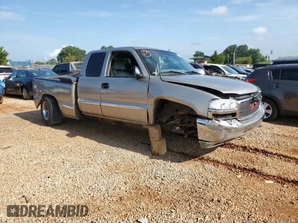 2002 GMC Sierra 1500 SLE with VIN 2GTEK19TX21244121, listed as a Copart auction lot 63050985 with 217,090 mi miles and Salvage title. Bid and sale history available at DreamBid. Image 4.