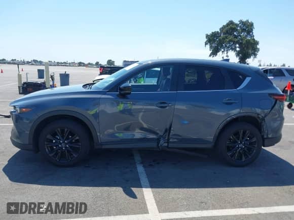 2022 Mazda CX-5 S Carbon Edition z VIN JM3KFBCM7N1601447, wystawiony jako IAAI lot #42463014 z przebiegiem 37 126 mil mil oraz . Historia ofert i sprzedaży dostępna na DreamBid. Obrazek 14.