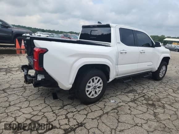 2024 Toyota Tacoma SR5 with VIN 3TYLB5JN2RT035281, listed as a Copart auction lot 69350095 with 9,907 mi miles and Salvage title. Bid and sale history available at DreamBid. Image 3.