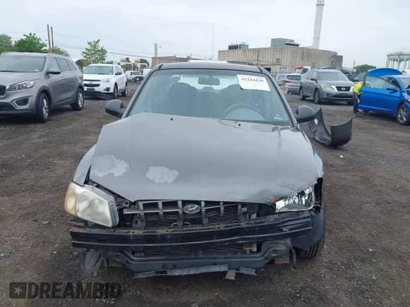 2002 Hyundai Accent GL z VIN KMHCG45C52U372587, wystawiony jako IAAI lot #42244428 z przebiegiem 43 538 mil mil oraz . Historia ofert i sprzedaży dostępna na DreamBid. Obrazek 12.