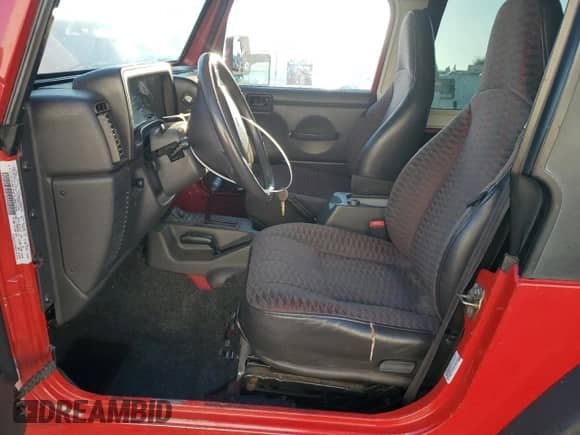 2000 Jeep Wrangler Sport z VIN 1J4FA49SXYP768858, wystawiony jako Copart lot #72104145 z przebiegiem 228 361 mil mil oraz Szkoda całkowita • Salvage title. Historia ofert i sprzedaży dostępna na DreamBid. Obrazek 7.