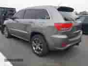 2012 Jeep Grand Cherokee SRT-8 z VIN 1C4RJFDJ8CC112350, wystawiony jako IAAI lot #42995991 z przebiegiem 210 738 mil mil oraz . Historia ofert i sprzedaży dostępna na DreamBid. Obrazek 3.