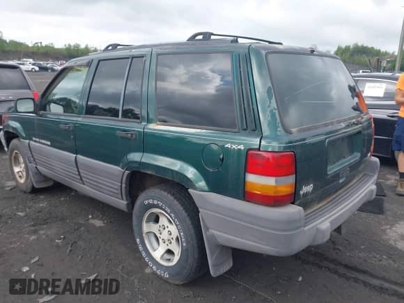 1996 Jeep Grand Cherokee with VIN 1J4EZ58Y7TC128302, listed as a IAAI auction lot 42643449 with 282,036 mi miles and . Bid and sale history available at DreamBid. Image 3.