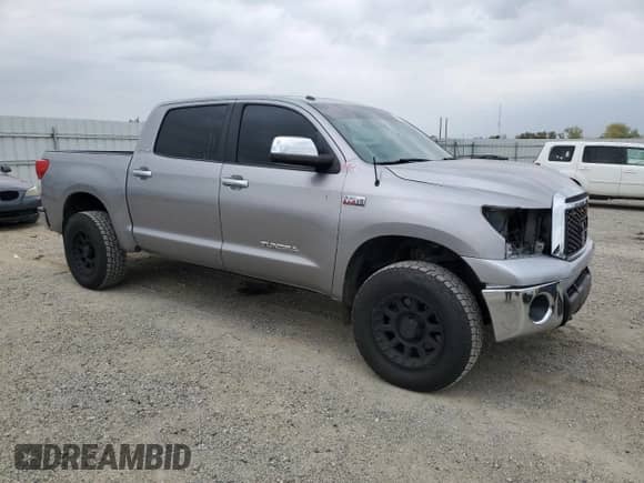 2012 Toyota Tundra Limited with VIN 5TFHY5F13CX241054, listed as a Copart auction lot 90242605 with 122,532 mi miles and Salvage title. Bid and sale history available at DreamBid. Image 4.