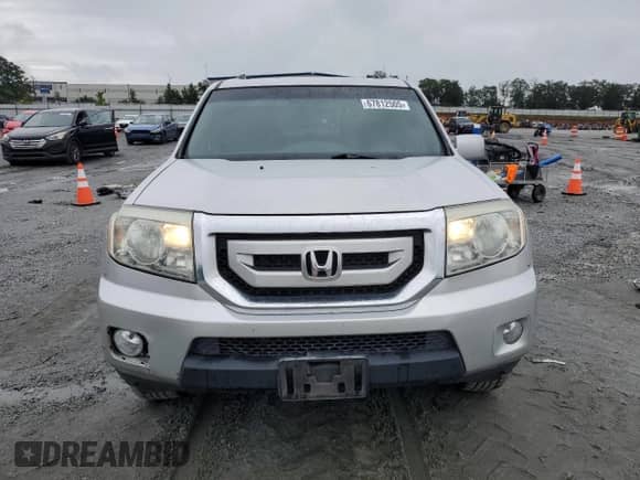 2009 Honda Pilot Touring with VIN 5FNYF38839B027611, listed as a Copart auction lot 67812505 with 148,357 mi miles and Salvage title. Bid and sale history available at DreamBid. Image 5.