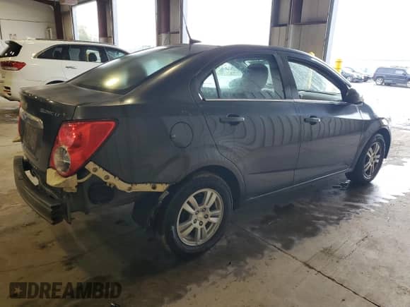 2014 Chevrolet Sonic LT с VIN 1G1JC5SG0E4209427, выставлен на аукционе Copart как лот 71691335 с пробегом 183 935 миль миль и Списание • Salvage title. История ставок и продаж доступна на DreamBid. Изображение 3.