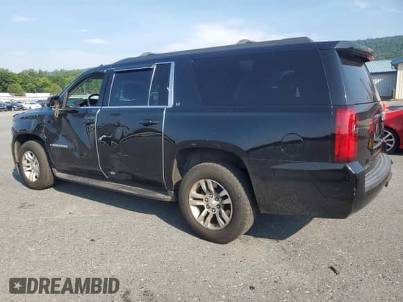 2019 Chevrolet Suburban LT with VIN 1GNSKHKCXKR157646, listed as a Copart auction lot 66486525 with 136,121 mi miles and Salvage title. Bid and sale history available at DreamBid. Image 2.