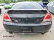 2006 Hyundai Tiburon GT z VIN KMHHN65F66U215304, wystawiony jako Copart lot #56141635 z przebiegiem 149 118 mil mil oraz Szkoda całkowita • Salvage title. Historia ofert i sprzedaży dostępna na DreamBid. Obrazek 6.