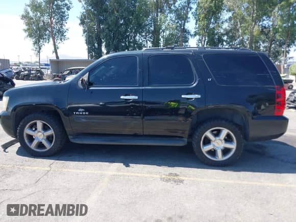 2009 Chevrolet Tahoe 2LT with VIN 1GNFC23059R295332, listed as a IAAI auction lot 42679966 with 223,678 mi miles and . Bid and sale history available at DreamBid. Image 14.