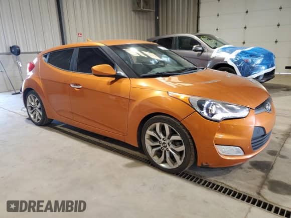 2014 Hyundai Veloster z VIN KMHTC6AD4EU212324, wystawiony jako Copart lot #71514455 z przebiegiem 120 419 mil mil oraz Czysty tytuł • Clean title. Historia ofert i sprzedaży dostępna na DreamBid. Obrazek 4.