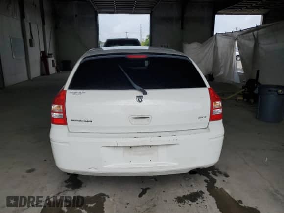 2006 Dodge Magnum z VIN 2D4FV47V36H436837, wystawiony jako Copart lot #70883025 z przebiegiem 206 603 mil mil oraz Szkoda całkowita • Salvage title. Historia ofert i sprzedaży dostępna na DreamBid. Obrazek 6.