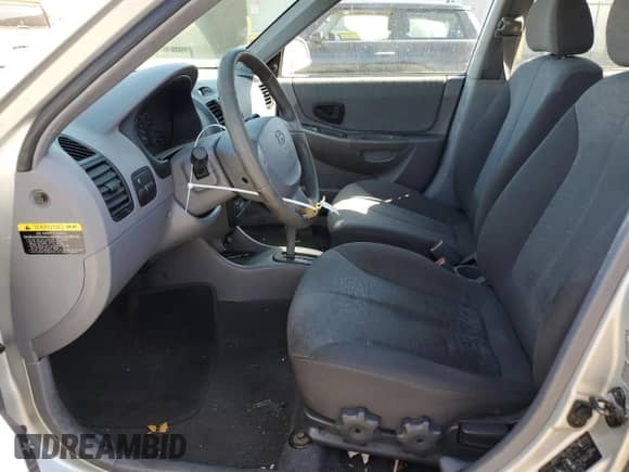 2003 Hyundai Accent GL с VIN KMHCG45CX3U488238, выставлен на аукционе Copart как лот 74399014 с пробегом 130 915 миль миль и Чистый • Clean title. История ставок и продаж доступна на DreamBid. Изображение 7.