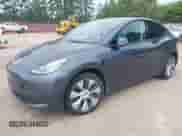 2021 Tesla Model Y Long Range with VIN 5YJYGDEE1MF217624, listed as a IAAI auction lot 42842945 with 58,610 mi miles and . Bid and sale history available at DreamBid. Image 2.
