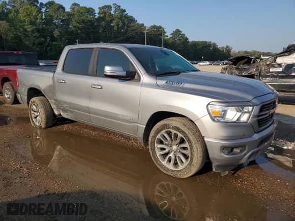 2019 Ram 1500 Big Horn with VIN 1C6RREFT1KN666812, listed as a Copart auction lot 80140395 with 128,037 mi miles and Salvage title. Bid and sale history available at DreamBid. Image 4.