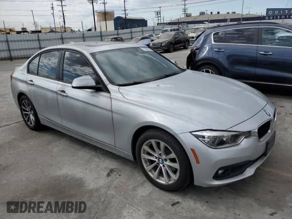 2018 BMW 3 Series 320i with VIN WBA8A9C50JAH13343, listed as a Copart auction lot 70562555 with 110,990 mi miles and Salvage title. Bid and sale history available at DreamBid. Image 4.