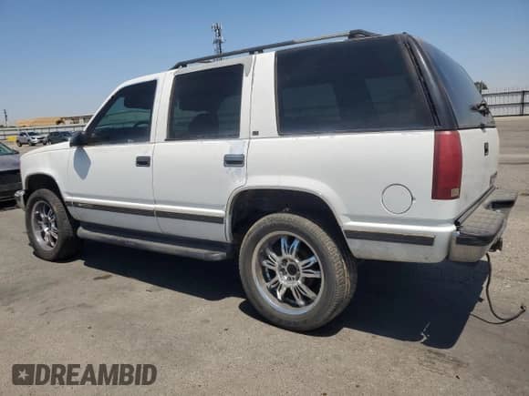 1996 Chevrolet Tahoe с VIN 1GNEK13R2TJ414225, выставлен на аукционе Copart как лот 65547245 с пробегом 209 449 миль миль и Списание • Salvage title. История ставок и продаж доступна на DreamBid. Изображение 2.