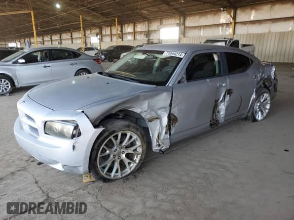 2009 Dodge Charger SE with VIN 2B3KA43D39H505990, listed as a Copart auction lot 71044214 with 223,573 mi miles and Salvage title. Bid and sale history available at DreamBid. Image 1.