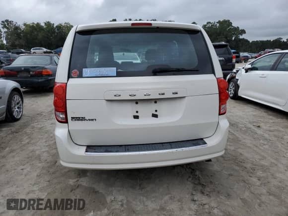 2013 Dodge Grand Caravan SE with VIN 2C4RDGBG5DR506482, listed as a Copart auction lot 83921775 with 124,348 mi miles and Salvage title. Bid and sale history available at DreamBid. Image 6.