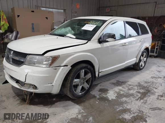 2009 Dodge Journey SXT with VIN 3D4GH57V29T593160, listed as a IAAI auction lot 43387864 with 122,911 mi miles and . Bid and sale history available at DreamBid. Image 2.