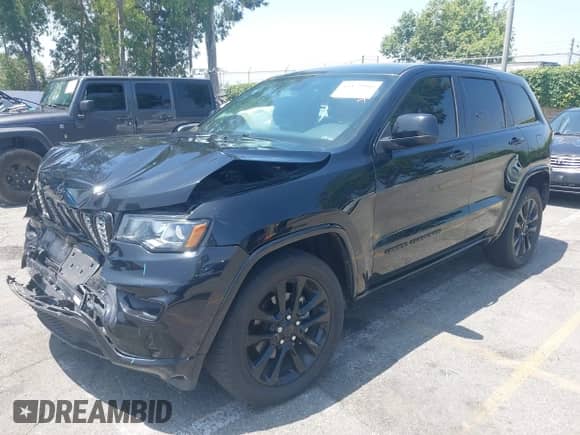 2018 Jeep Grand Cherokee Altitude with VIN 1C4RJEAG2JC428536, listed as a IAAI auction lot 42472960 with 74,631 mi miles and . Bid and sale history available at DreamBid. Image 2.