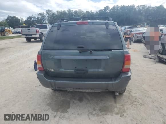 2004 Jeep Grand Cherokee Laredo with VIN 1J4GX48S24C314691, listed as a Copart auction lot 85491395 with 239,637 mi miles and Salvage title. Bid and sale history available at DreamBid. Image 6.