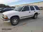 1999 Chevrolet Blazer LT z VIN 1GNDT13W1X2163194, wystawiony jako Copart lot #82897414 z przebiegiem Nie podano mil oraz Szkoda całkowita • Salvage title. Historia ofert i sprzedaży dostępna na DreamBid. Obrazek 1.