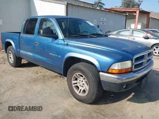 2002 Dodge Dakota SLT with VIN 1B7HL48N82S658321, listed as a IAAI auction lot 41506738 with 252,950 mi miles and . Bid and sale history available at DreamBid. Image 1.
