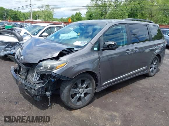 2015 Toyota Sienna SE with VIN 5TDXK3DC2FS559232, listed as a IAAI auction lot 42341965 with 130,732 mi miles and . Bid and sale history available at DreamBid. Image 2.