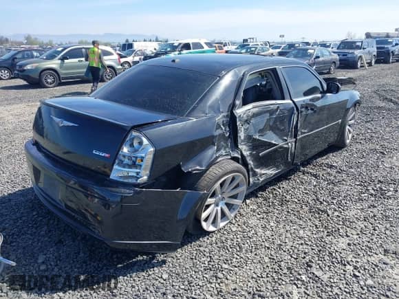 2006 Chrysler 300 C SRT-8 with VIN 2C3LA73W36H509656, listed as a IAAI auction lot 41852179 with 92,209 mi miles and . Bid and sale history available at DreamBid. Image 4.