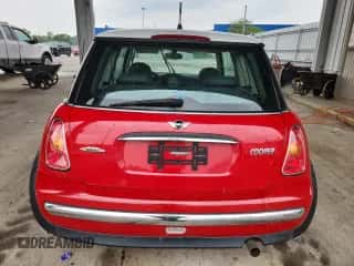 2004 MINI Hardtop with VIN WMWRC33474TJ59565, listed as a Copart auction lot 60507235 with 88,920 mi miles and Salvage title. Bid and sale history available at DreamBid. Image 6.