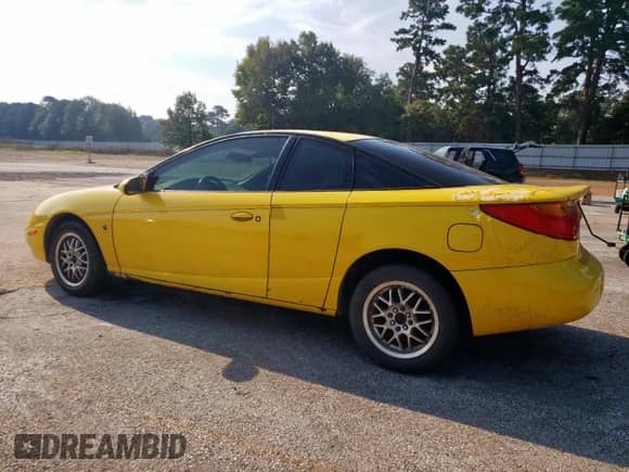2001 Saturn SC with VIN 1G8ZY12771Z320035, listed as a Copart auction lot 80707645 with 149,680 mi miles and Salvage title. Bid and sale history available at DreamBid. Image 2.