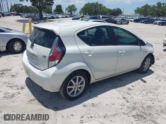 2015 Toyota Prius One z VIN JTDKDTB33F1087207, wystawiony jako IAAI lot #42776015 z przebiegiem 153 820 mil mil oraz . Historia ofert i sprzedaży dostępna na DreamBid. Obrazek 4.