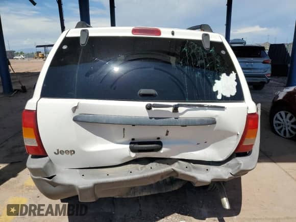 2003 Jeep Grand Cherokee Laredo z VIN 1J4GX48S53C518626, wystawiony jako Copart lot #71123695 z przebiegiem 196 154 mil mil oraz Szkoda całkowita • Salvage title. Historia ofert i sprzedaży dostępna na DreamBid. Obrazek 6.