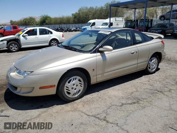 1999 Saturn SC with VIN 1G8ZY1277XZ299213, listed as a Copart auction lot 63788405 with 54,699 mi miles and Salvage title. Bid and sale history available at DreamBid. Image 1.