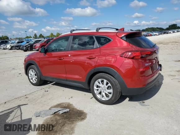2021 Hyundai Tucson Value with VIN KM8J33A42MU406502, listed as a Copart auction lot 83878815 with 126,612 mi miles and Salvage title. Bid and sale history available at DreamBid. Image 2.