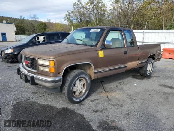 1994 GMC Sierra 1500 with VIN 2GTEK19K1R1548357, listed as a Copart auction lot 82556885 with 157,548 mi miles and Clean title. Bid and sale history available at DreamBid. Image 1.