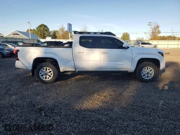 2024 Toyota Tacoma SR5 z VIN 3TYLB5JN6RT040080, wystawiony jako Copart lot #86147085 z przebiegiem 7 596 mil mil oraz Szkoda całkowita • Salvage title. Historia ofert i sprzedaży dostępna na DreamBid. Obrazek 12.