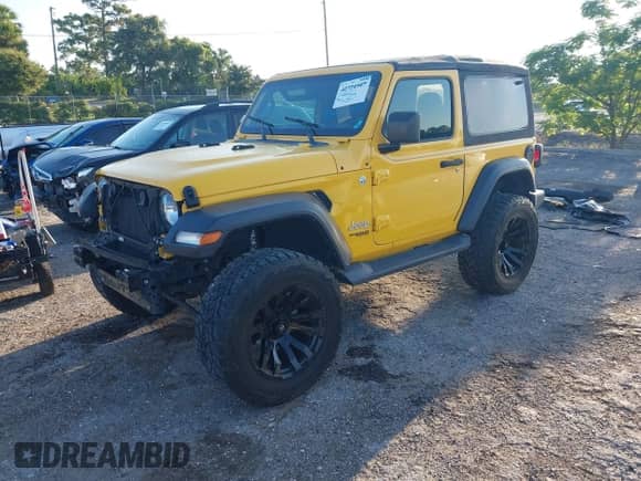 2020 Jeep Wrangler Sport S with VIN 1C4GJXAN7LW215407, listed as a IAAI auction lot 42840160 with 52,889 mi miles and . Bid and sale history available at DreamBid. Image 2.