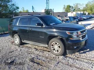 2015 Chevrolet Tahoe LT z VIN 1GNSKBKCXFR601739, wystawiony jako IAAI lot #43374752 z przebiegiem 199 334 mil mil oraz . Historia ofert i sprzedaży dostępna na DreamBid. Obrazek 1.