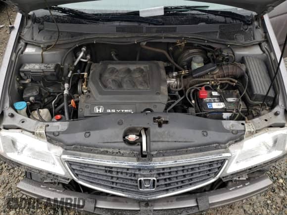 1999 Honda Odyssey LX with VIN 2HKRL185XXH510695, listed as a Copart auction lot 84907294 with 157,608 mi miles and Salvage title. Bid and sale history available at DreamBid. Image 12.