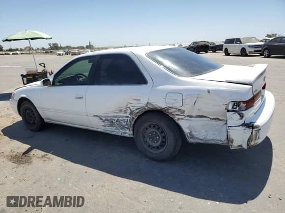 1997 Toyota Camry LE с VIN JT2BG22K8V0094885, выставлен на аукционе Copart как лот 69463945 с пробегом 158 049 миль миль и Списание • Salvage title. История ставок и продаж доступна на DreamBid. Изображение 2.