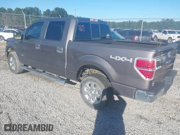 2013 Ford F-150 Lariat with VIN 1FTFW1ET5DKE51436, listed as a IAAI auction lot 43459885 with 149,455 mi miles and . Bid and sale history available at DreamBid. Image 3.
