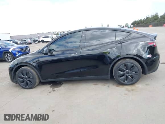 2024 Tesla Model Y with VIN 7SAYGDED8RF156984, listed as a IAAI auction lot 43324819 with 26,941 mi miles and . Bid and sale history available at DreamBid. Image 14.