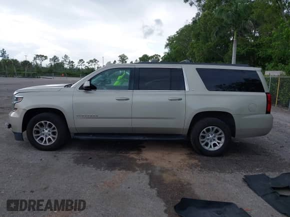 2016 Chevrolet Suburban LT z VIN 1GNSCHKCXGR282232, wystawiony jako IAAI lot #42650483 z przebiegiem 143 325 mil mil oraz . Historia ofert i sprzedaży dostępna na DreamBid. Obrazek 14.