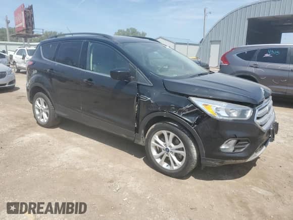 2018 Ford Escape SE z VIN 1FMCU9GD8JUB75679, wystawiony jako Copart lot #68539115 z przebiegiem 168 881 mil mil oraz Szkoda całkowita • Salvage title. Historia ofert i sprzedaży dostępna na DreamBid. Obrazek 4.
