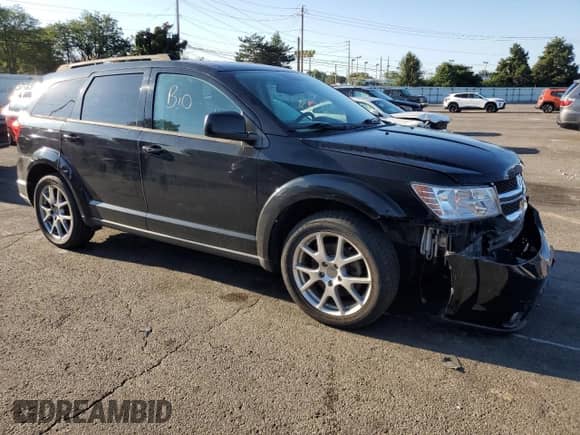 2014 Dodge Journey SXT with VIN 3C4PDCBG5ET153224, listed as a Copart auction lot 70207755 with 123,051 mi miles and Salvage title. Bid and sale history available at DreamBid. Image 4.
